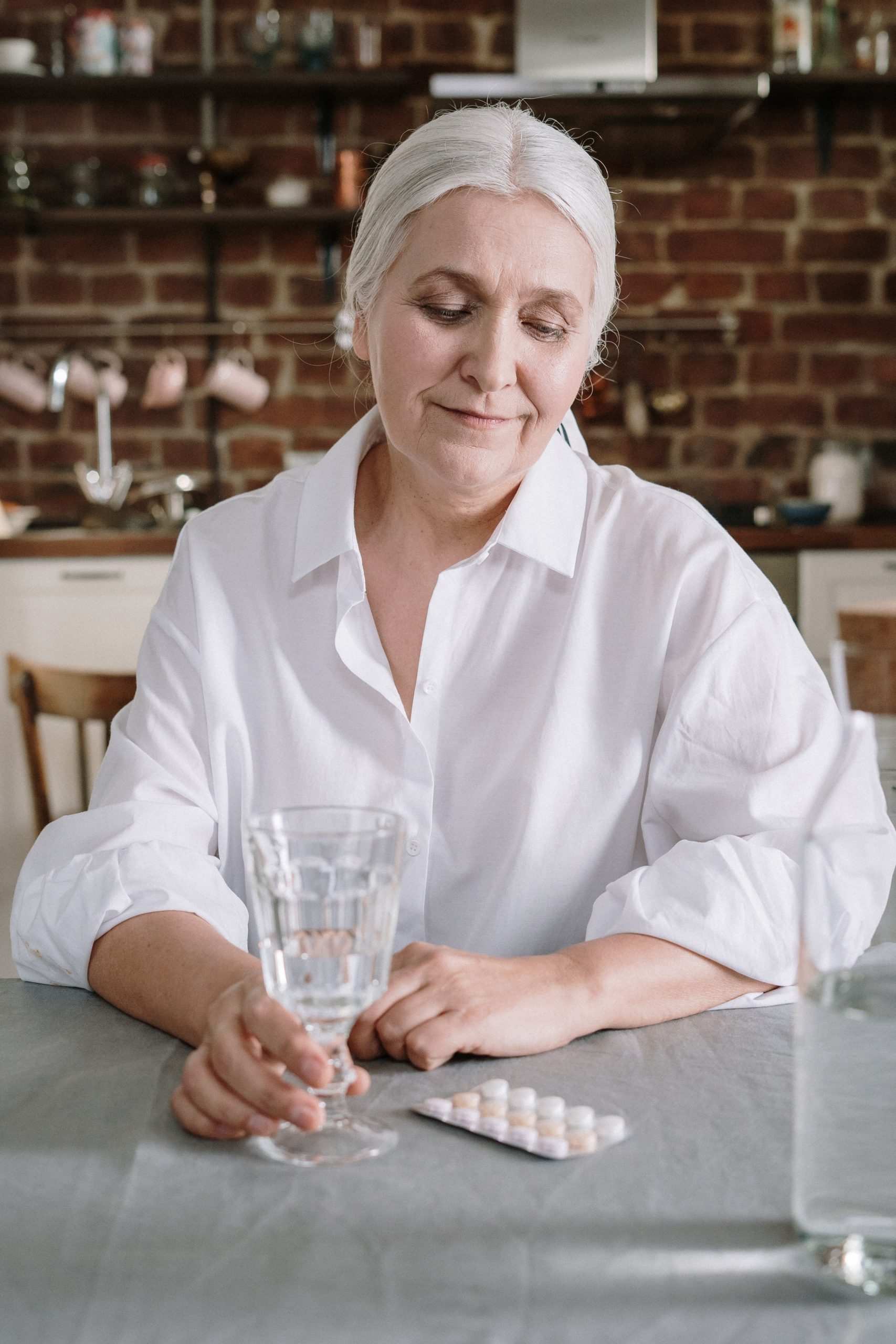 Older-woman-taking-tablets