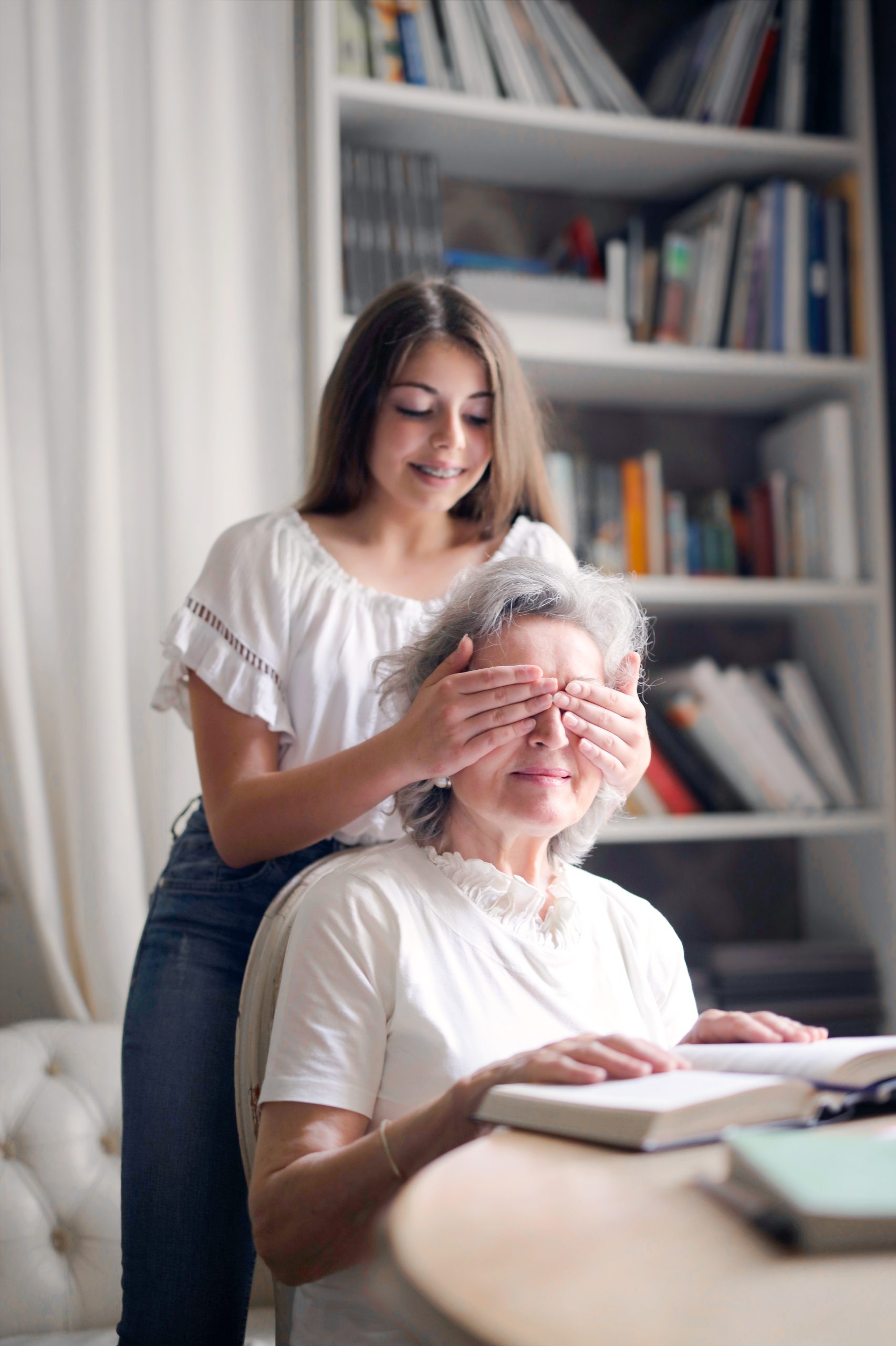 carer playing with elderly lady