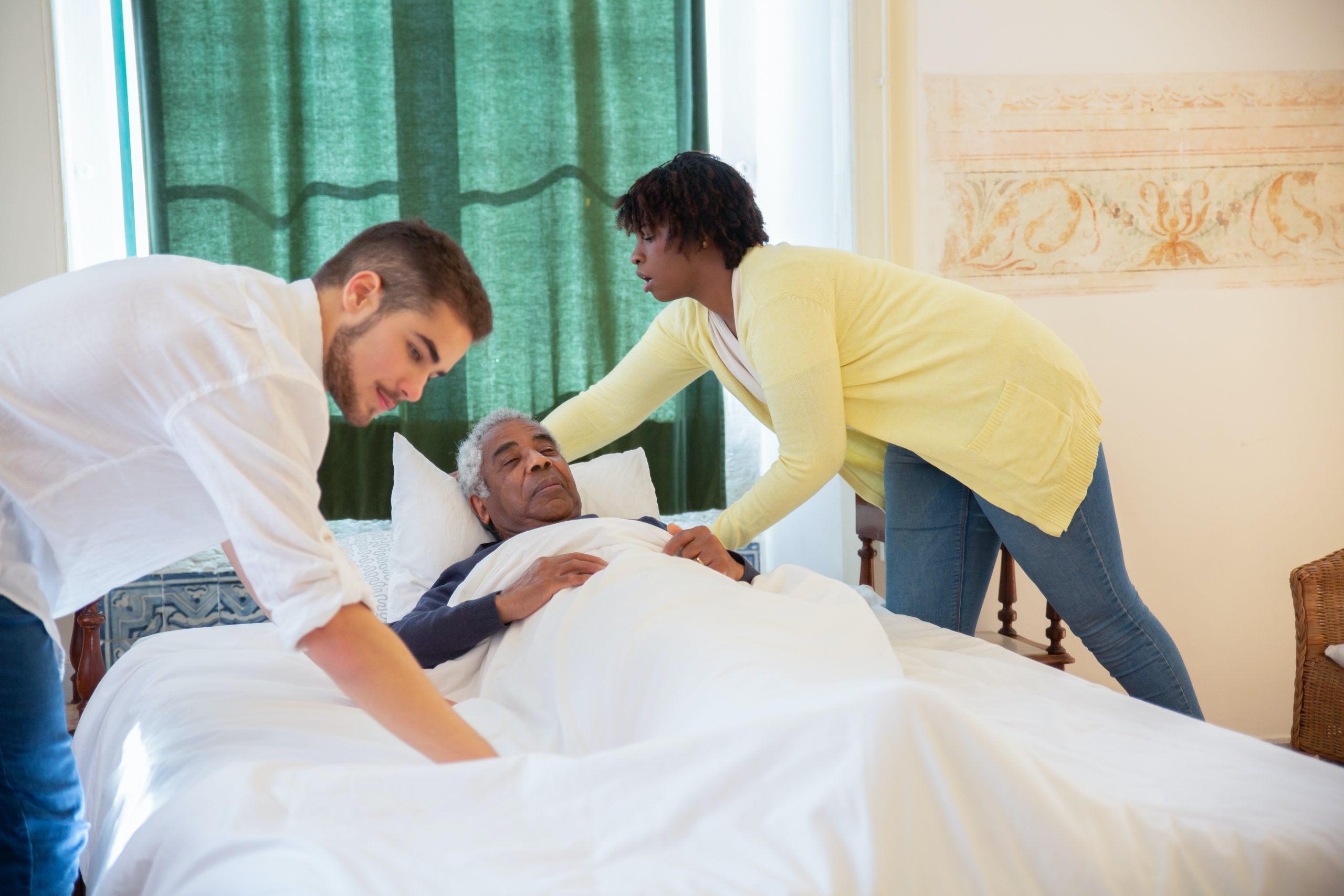 elderly-man-lying-in-bed